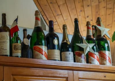 Old Wine Bottles on Display at Le Chene